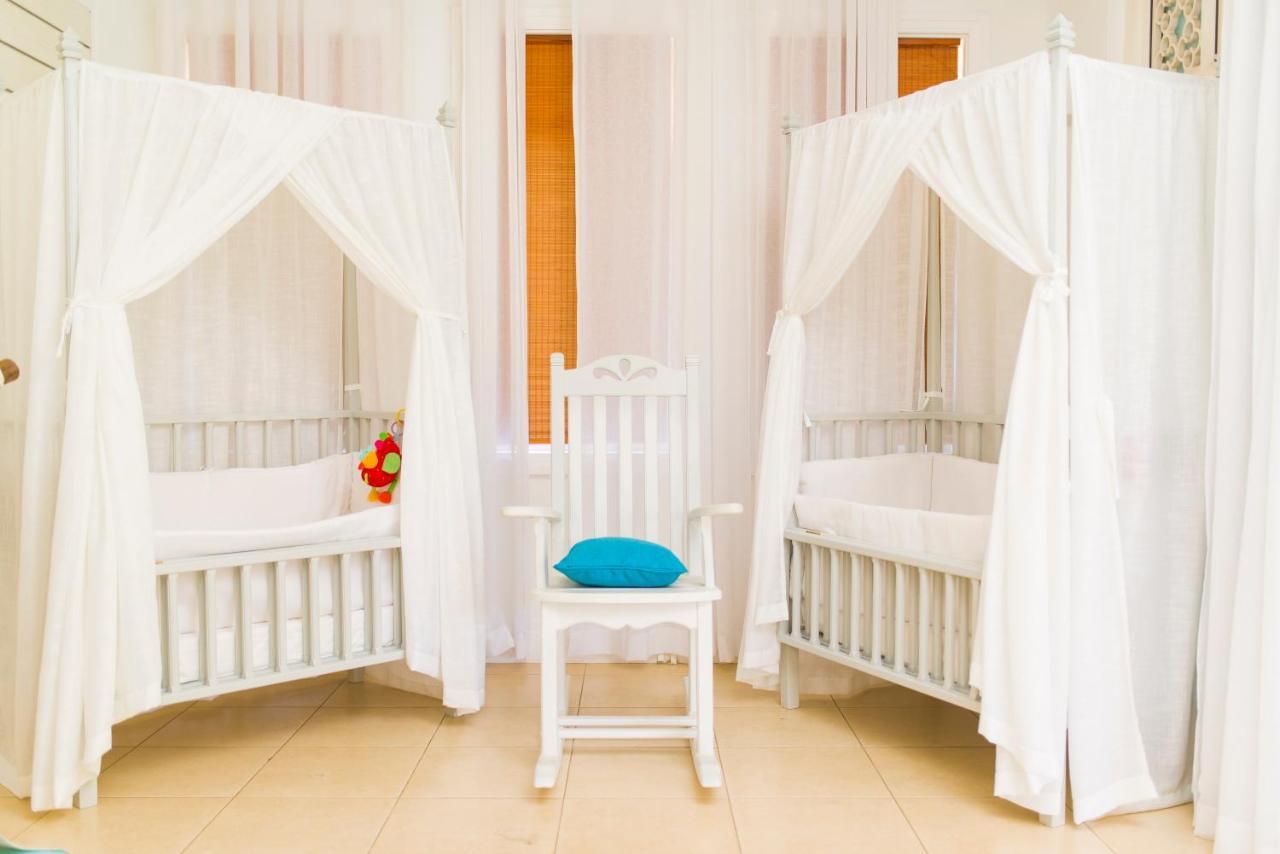 Heritage Le Telfair Golf & Wellness Resort Bel Ombre Exterior photo Two cots with mosquito nets